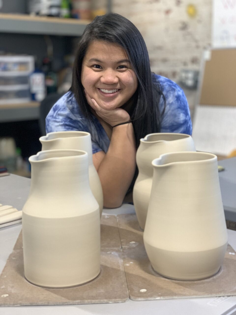 Katie Meili Messersmith, ceramic artist and instructor, with leather hard clay pitchers