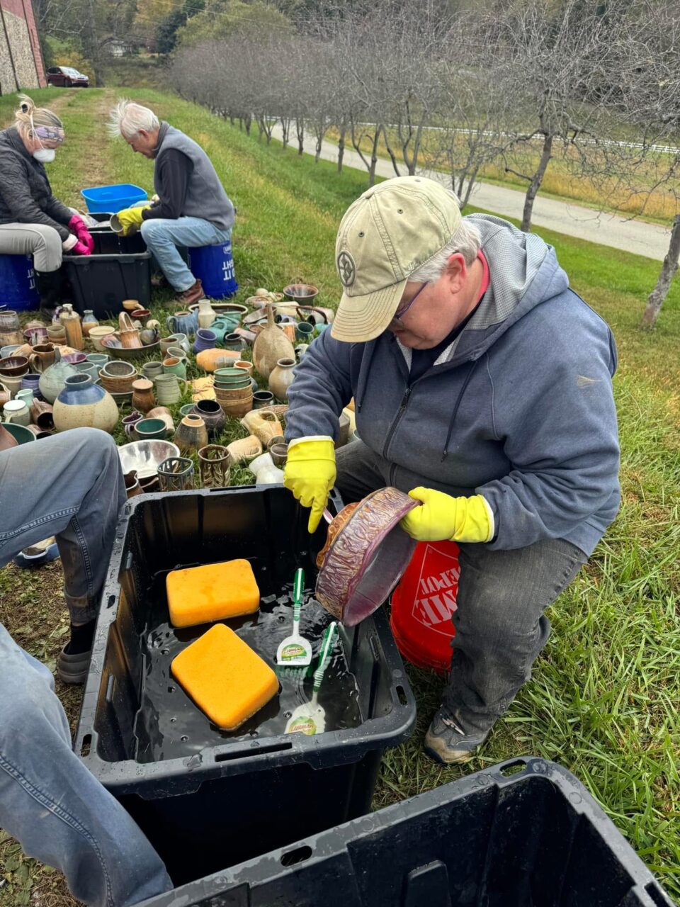 Julia Mann and volunteers washing pots after the flood at the barn 2