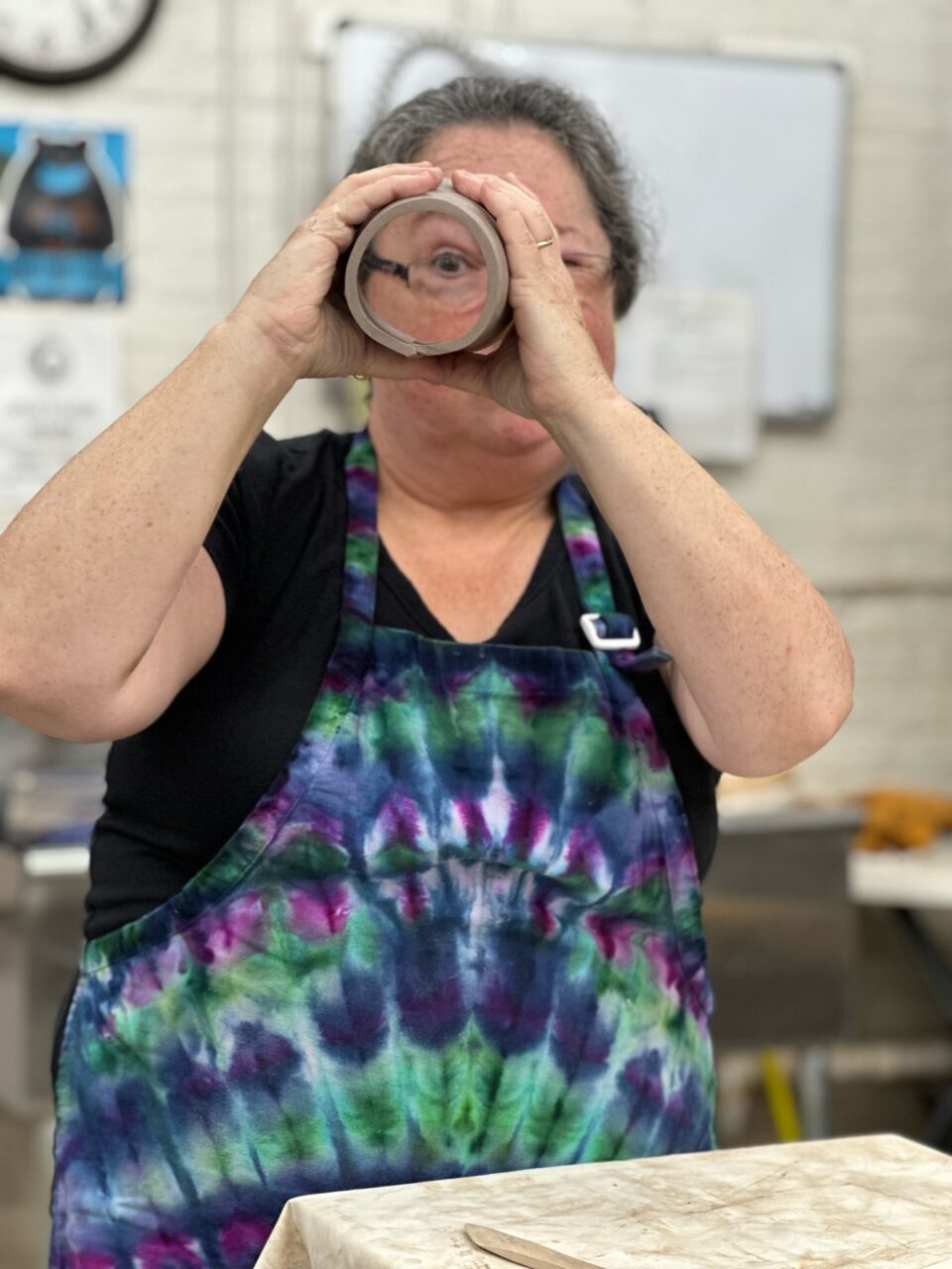 Karen Dubois peeking through slab cylinder