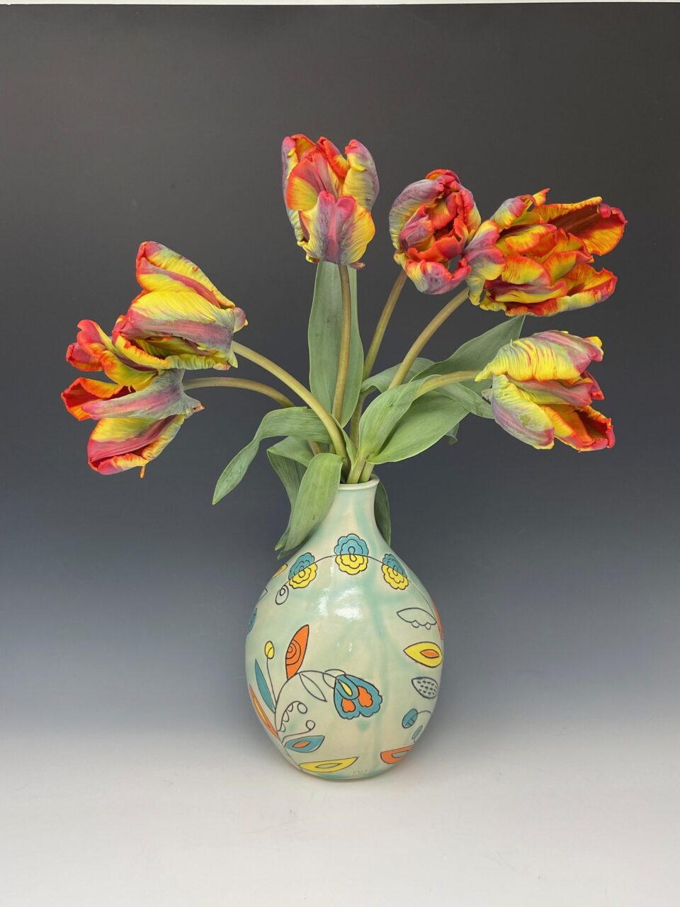 Maria Andrade Troya finished pot, vase with flowers, surface design