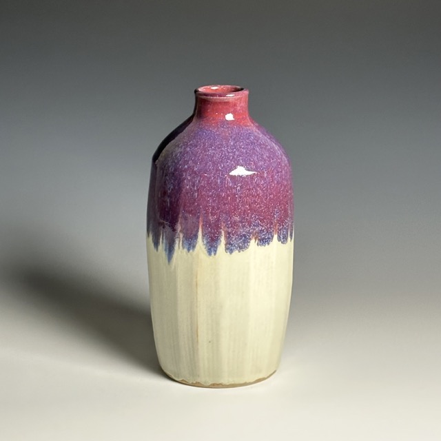Julia Mann finished pot, bottle vase glazed in plum chun and mamo