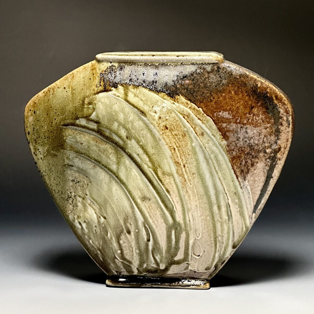 Sarah Wells Rolland finished hand built pot, sea grass slip decoration, kazie wood soda fired