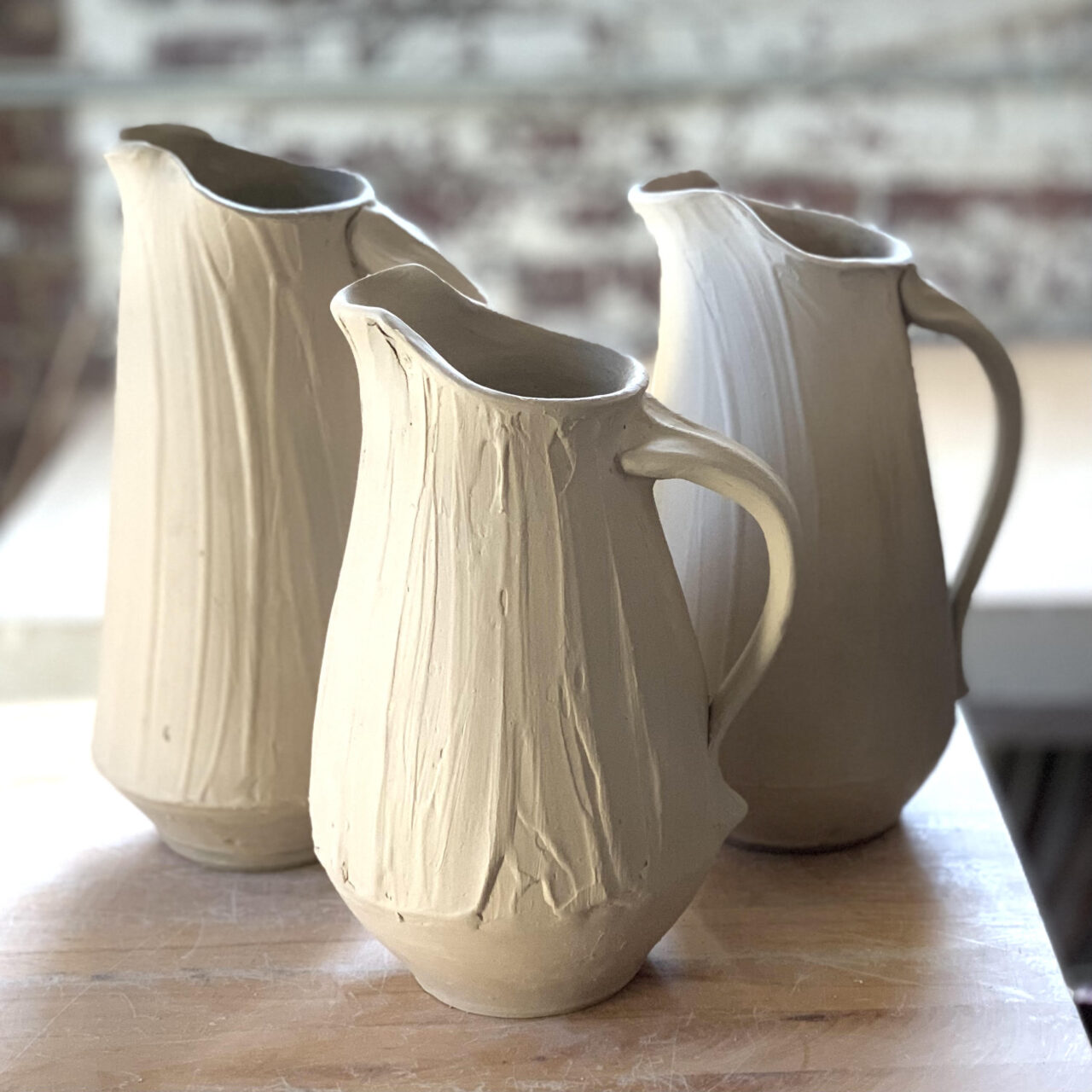 Sarah Wells Rolland leather hard pots, pitchers pouring vessels, slip surface