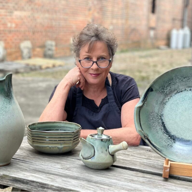 Sarah Wells Rolland square headshot with finished pots