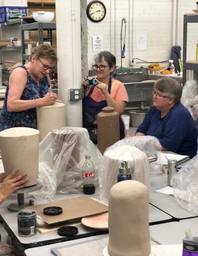 Sarah Wells Rolland demonstrating in teaching center class, intermediate hand building