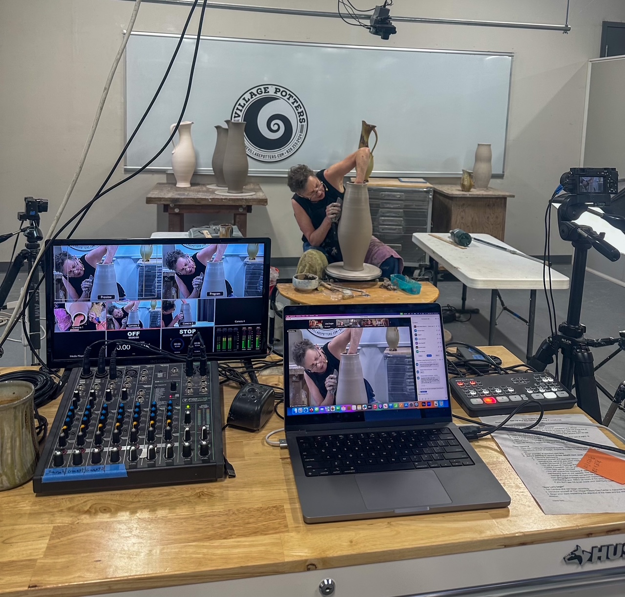 Sarah Wells Rolland throwing on potters wheel, teaching online class 4, view of mixing board and camera angles