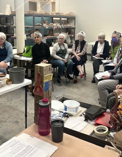 Karen Dubois demonstrating for her teaching center students, hand building, intermediate hand building